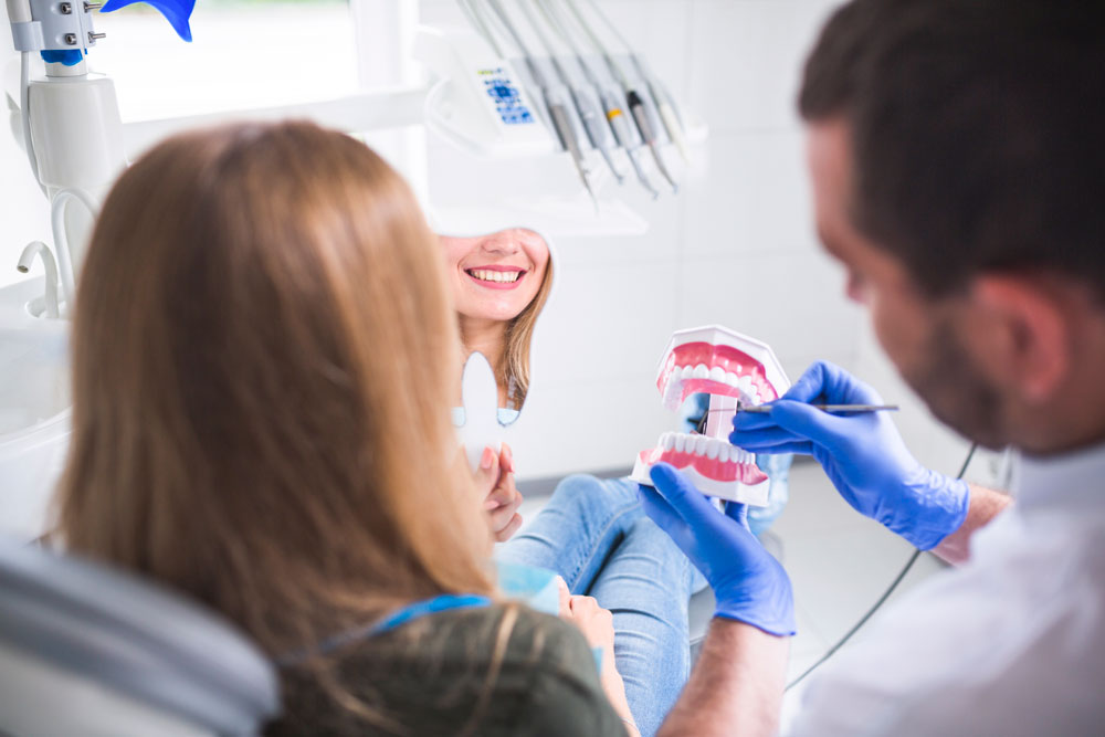 A dentist examining a patient.