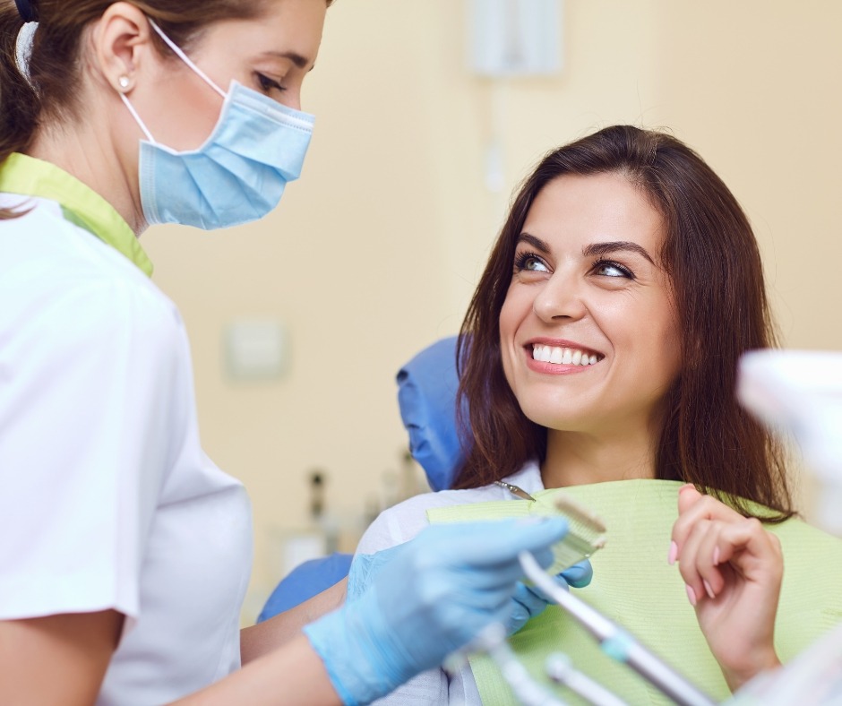 A dentist working with a patient. Contact us today.