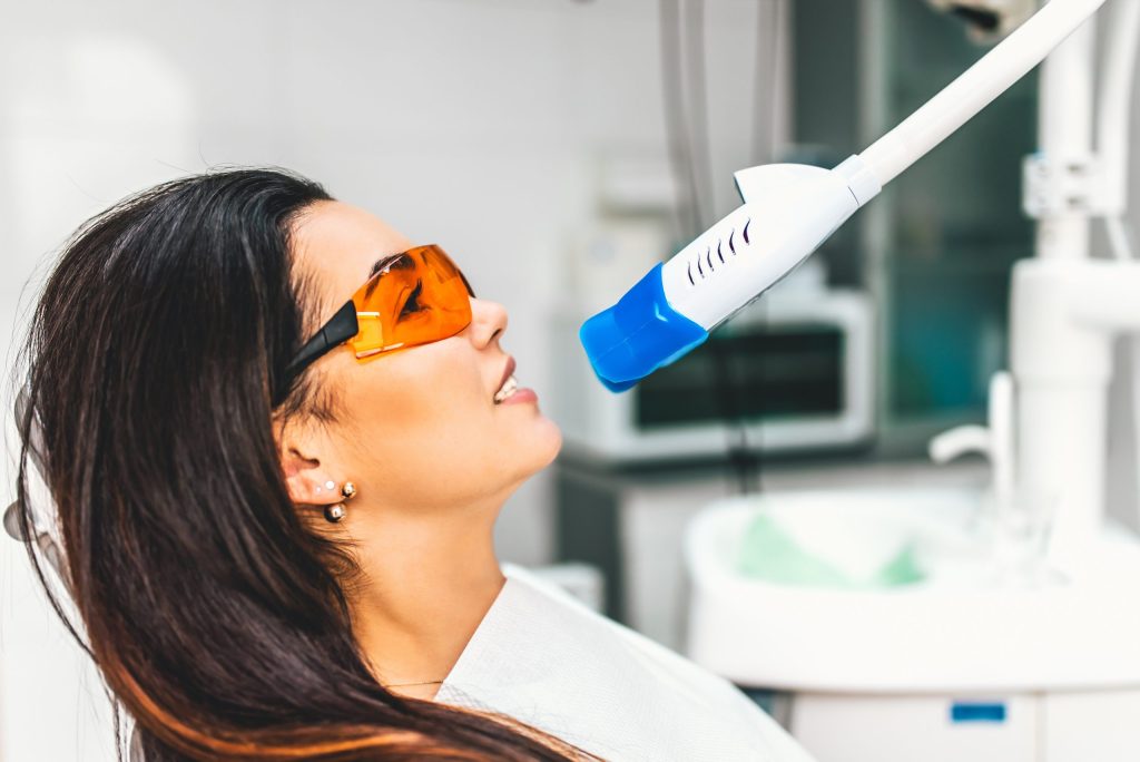 Patient wearing protective glasses during teeth whitening