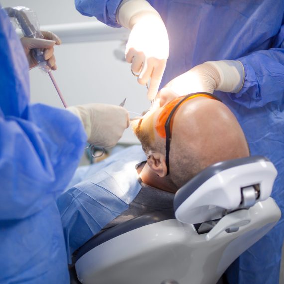A wisdom tooth extraction surgery in progress in a dental hospital. Dental check up.